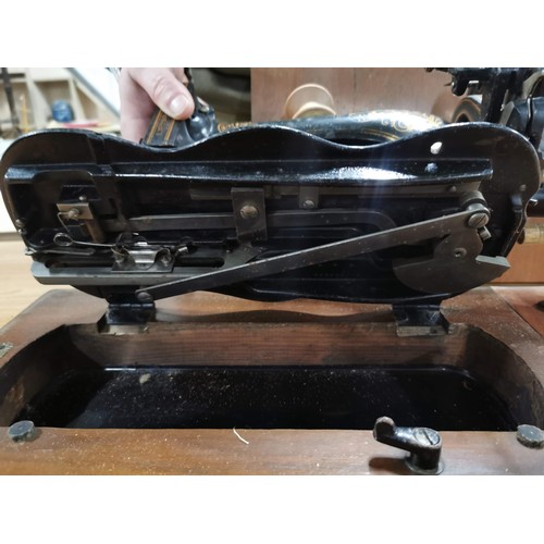 269 - Antique 1875 Singer sewing machine in excellent condition in original case along with a quantity of ... 