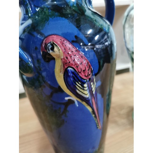 411 - Very good quality glazed terracotta painted vase with a raised 3d parrot design perched on a tree wi... 