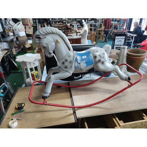 5 - A retro 1980's child's plastic rocking horse on steel frame in dappled grey. 89cm high, 130cm length... 