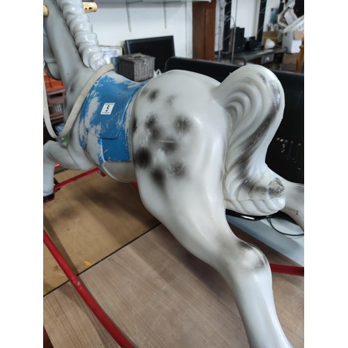 5 - A retro 1980's child's plastic rocking horse on steel frame in dappled grey. 89cm high, 130cm length... 