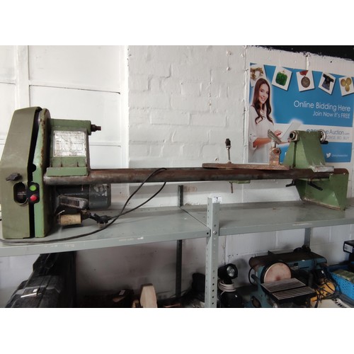 7 - A vintage Elektra lathe complete with winding platform, electric motor, and accessories. 
Height of ... 