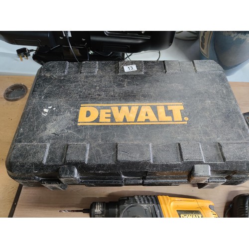 13 - A cased DeWalt heavy duty cordless hand drill, model DE0246 complete with charger and working batter... 