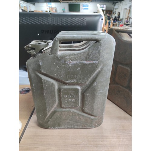 21 - 2x vintage 20l jerry cans, one with broad arrow 1978, the other stamped 1980. Both in good order, ta... 