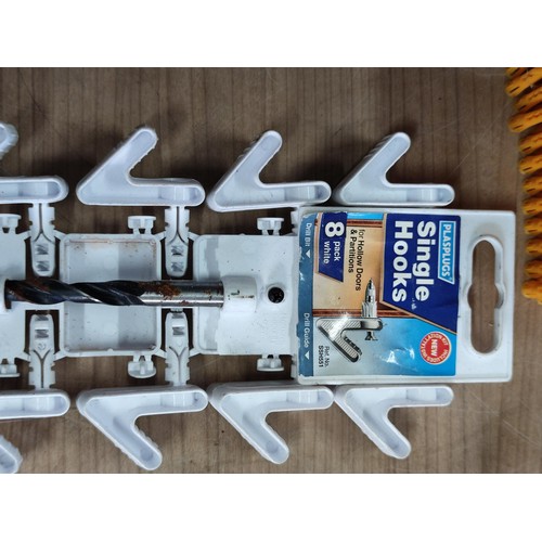 22 - A box containing a large quantity of new single and double  plasplug hooks along with a a large quan... 