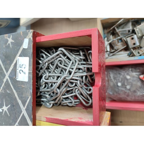 25 - A 9 drawer wooden storage chest containing a quantity of nails, link chain and angle brackets, along... 