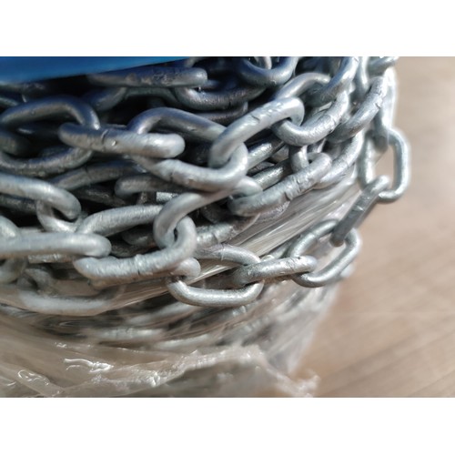 31 - A full new reel of interlocking galvanized chain with 1