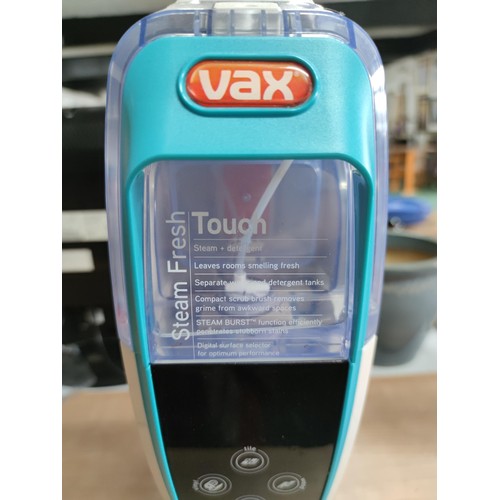 65 - A Vax steam fresh floor cleaner. Works on tiles, vinyl, carpet and wood. Complete with towel pad.