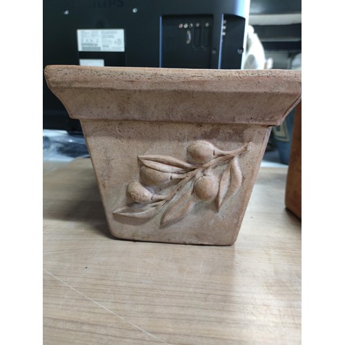 78 - A vintage terracotta planter with a quince decoration design along with a hexagonal shaped terracott... 