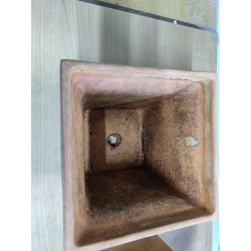 78 - A vintage terracotta planter with a quince decoration design along with a hexagonal shaped terracott... 