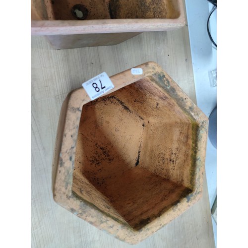 78 - A vintage terracotta planter with a quince decoration design along with a hexagonal shaped terracott... 