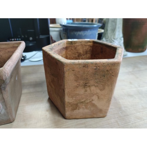 78 - A vintage terracotta planter with a quince decoration design along with a hexagonal shaped terracott... 