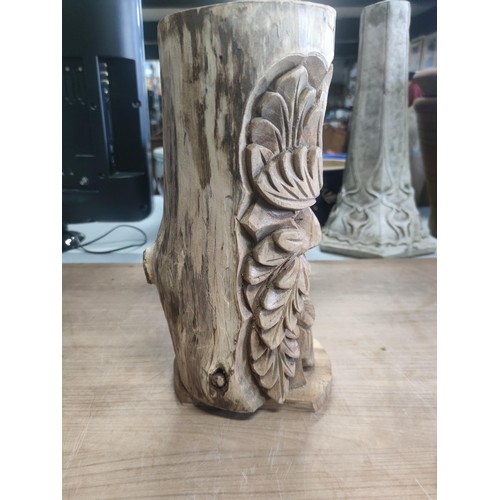 82 - A solid wood bird box with a detailed carving of the green man. In good order.
Height 34cm, diameter... 