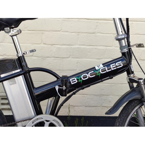 97 - A Byocycles electric fold up bike with front suspension, Shimano gears and complete with charger and... 