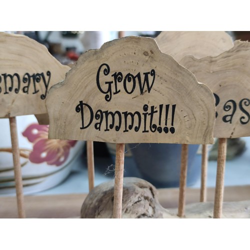 109 - A log formed vegetable marker stand including potatoes, rosemary, thyme, radish, etc. Stand has leng... 