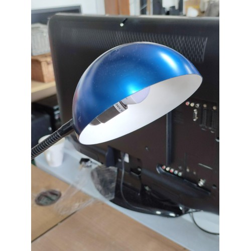 110 - A blue shaded desktop lamp with flexable adjustment.
Stands 72cm high.