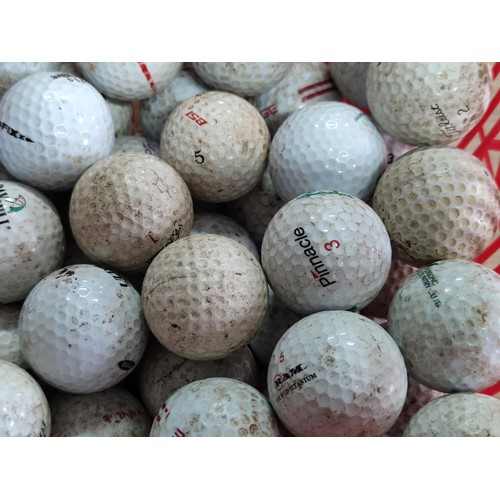 111 - A small plastic crate containing over 50 golf balls, including pinnacle, Dunlop, Callaway, Titleist,... 