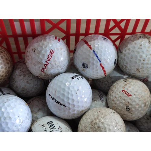 111 - A small plastic crate containing over 50 golf balls, including pinnacle, Dunlop, Callaway, Titleist,... 