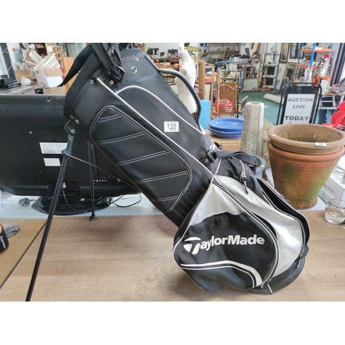 120 - A tailor made lightweight golf bag complete with harness and free standing legs in good order, hardl... 