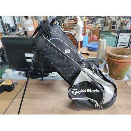 120 - A tailor made lightweight golf bag complete with harness and free standing legs in good order, hardl... 