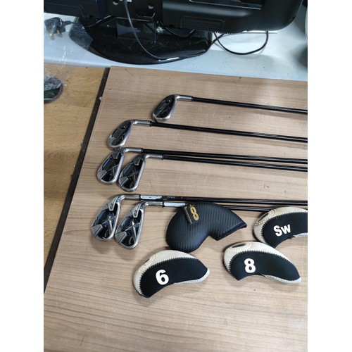 121 - A set of 6 irons by Callaway including 3,4,5,6,8 and 9. Complete with 5 socks, graphite shafts and o... 