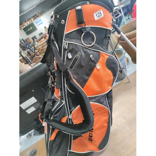 125 - A Dunlop free standing lightweight golf bag in excellent condition with harness and stand, divisiona... 