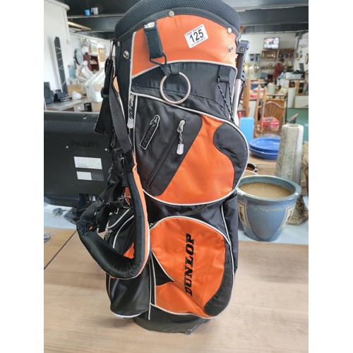 125 - A Dunlop free standing lightweight golf bag in excellent condition with harness and stand, divisiona... 