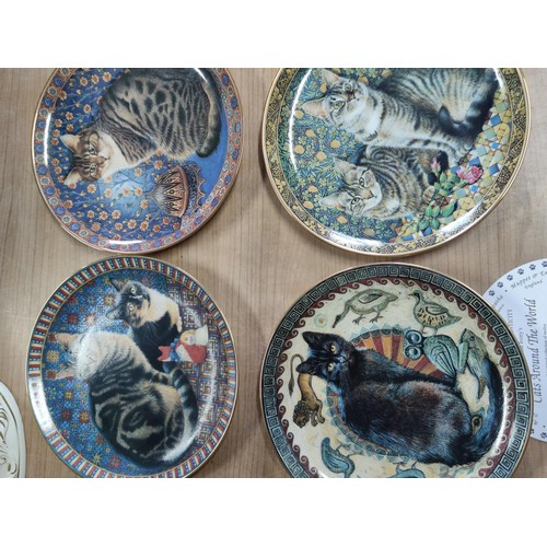 136 - A collection of 12 limited edition lesley Anne ivory's cats around the world danbury mint, including... 