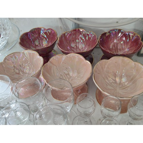 138 - A collection of glassware including wine, sherry and port glasses all with etched star design along ... 