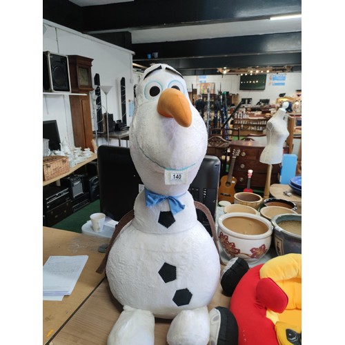 140 - An oversized Olaf of Frozen soft toy along with little tikes car formed seat with mirror and working... 