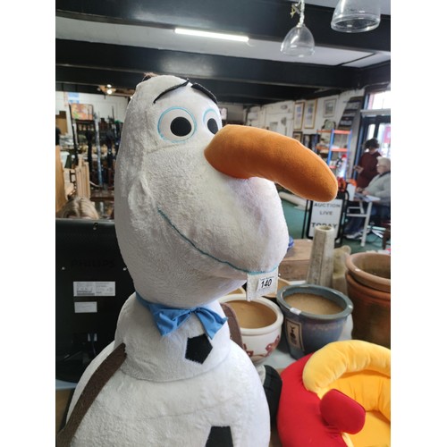 140 - An oversized Olaf of Frozen soft toy along with little tikes car formed seat with mirror and working... 