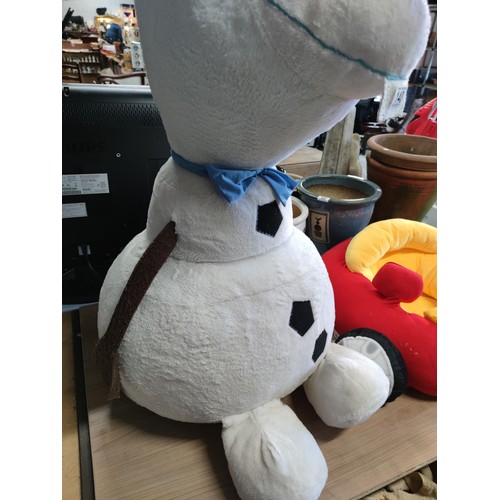 140 - An oversized Olaf of Frozen soft toy along with little tikes car formed seat with mirror and working... 