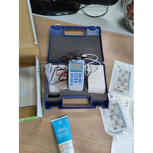 146 - A cased premier stim plus digital tens machine complete with pads, connectors, gel, etc. All in good... 