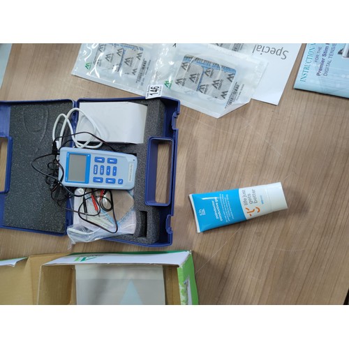 146 - A cased premier stim plus digital tens machine complete with pads, connectors, gel, etc. All in good... 