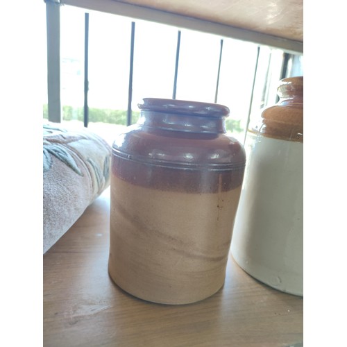 149 - A quantity of 3 stoneware storage jars all in good order. Tallest one has a height of 28cm.