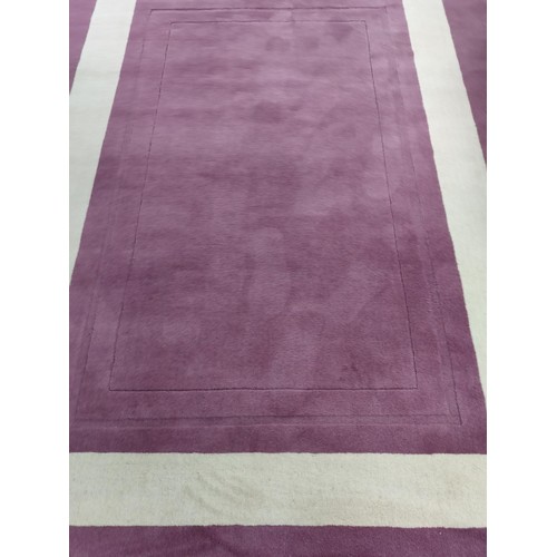 157 - A Laura Ashley Lewes rug in grape/raisin colour new with tags, retails at £325 with a nice geometric... 