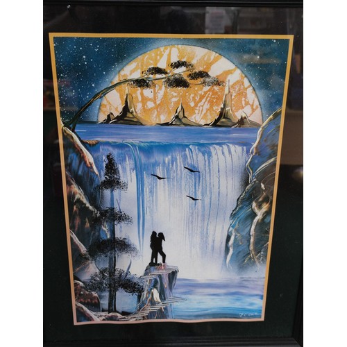 168 - A pair of framed and glazed fantasy prints of lovers, both depicting moonlit scenes by a waterfall s... 