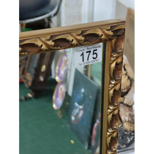 175 - A tall narrow gilt edged mirror with leaf design to the frame.
Height 123cm, width 35cm. In good ord... 