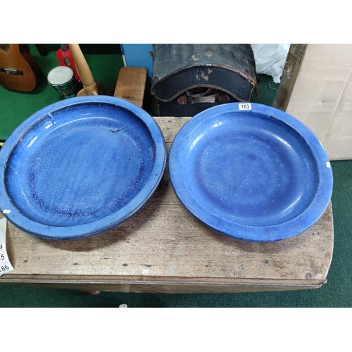 183 - A pair of blue terracotta large circular birdbaths largest has a diameter of 48cm.