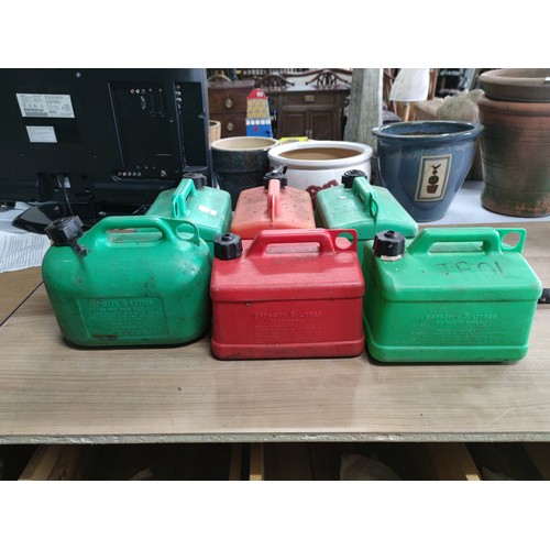 50 - A quantity of six 5l petrol cans (4 green 2 red) along with one nozzle.