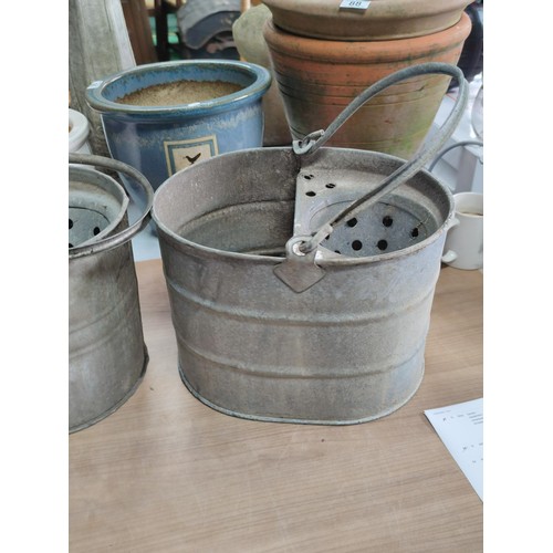 54 - A quantity of galvanized buckets including 2 mop buckets and 3 pales, one is marked Bemam 1952 with ... 