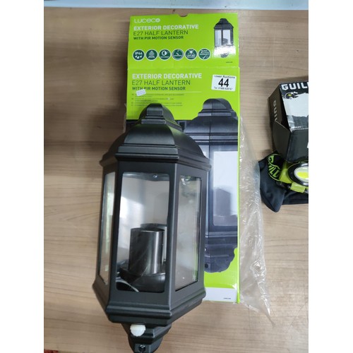 16 - A new in box exterior half lantern motion sensor light along with a new in box guild headtorch 100 l... 