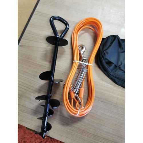 11 - Dog stay inc ground spike, orange cable complete with storage bag, in good order