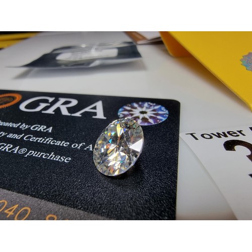 364 - A stunning 6ct moissanite diamond by GRA complete with its full paperwork and grading report. The st... 