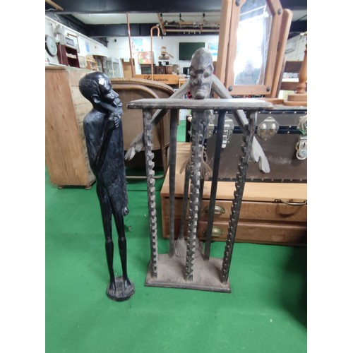 509 - A ethnic tall figure and a similar CD rack . the figure (76cm high is of heavy wood pos ebony