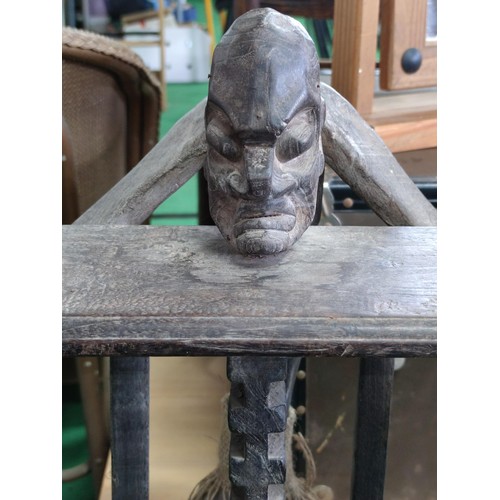 509 - A ethnic tall figure and a similar CD rack . the figure (76cm high is of heavy wood pos ebony