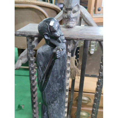 509 - A ethnic tall figure and a similar CD rack . the figure (76cm high is of heavy wood pos ebony