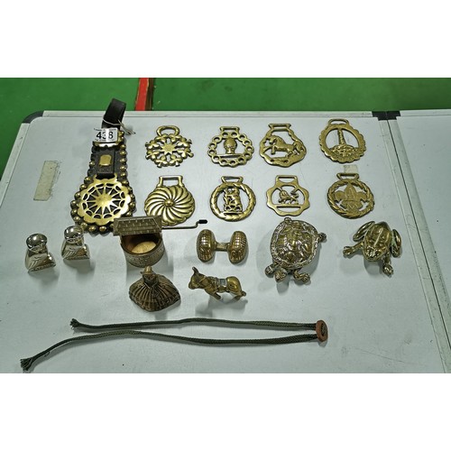 438 - Box containing a quantity of horse brasses, brass turtle, brass frog, welsh lady etc