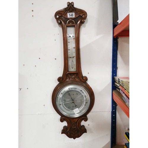 148 - Vintage oak well carved banjo barometer, screen is cracked, has a cased mercury thermometer to the t... 