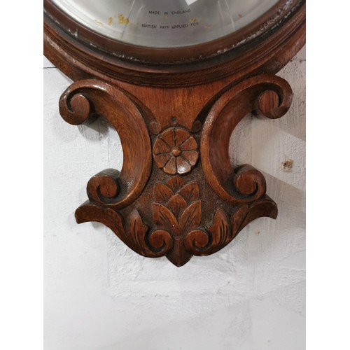 148 - Vintage oak well carved banjo barometer, screen is cracked, has a cased mercury thermometer to the t... 