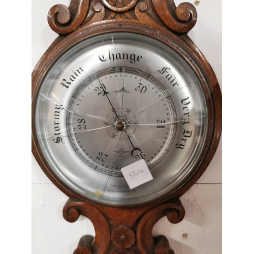 148 - Vintage oak well carved banjo barometer, screen is cracked, has a cased mercury thermometer to the t... 